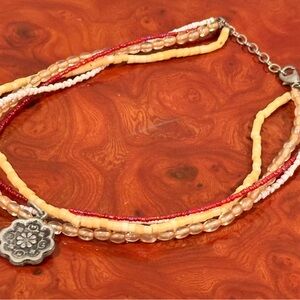 Elegant Beaded Necklace with Floral Charm